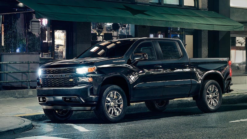 Silverado standing on road near building