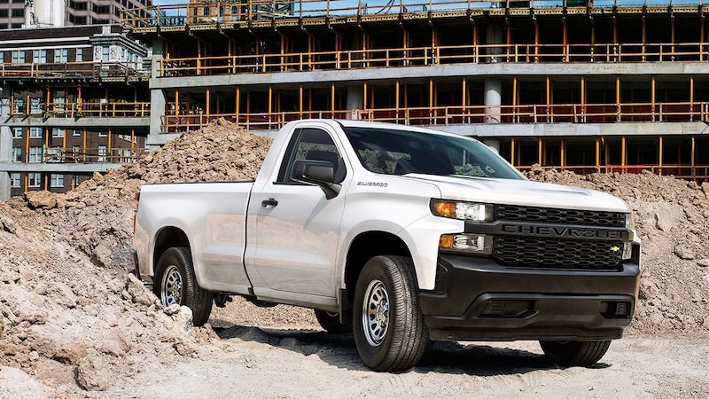 white Silverado parked at construction site